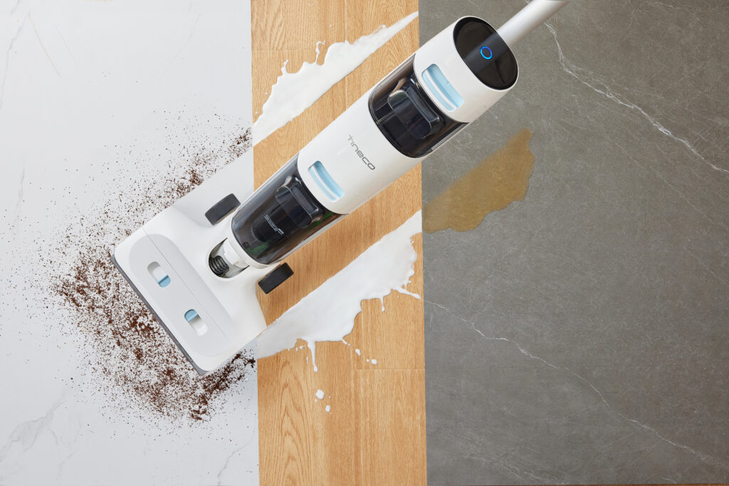 Tineco floor washer cleaning up dirt and milk