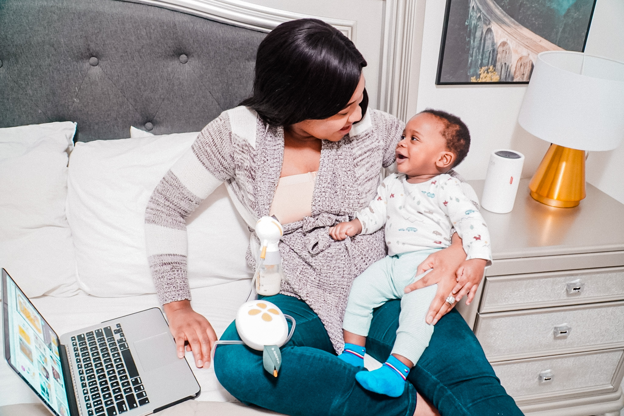 Medela breast pump bottle being used by a mom with a baby