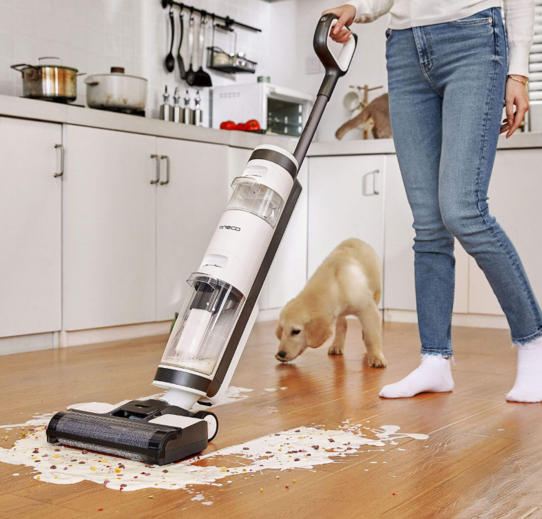 Tineco floor cleaner cleaning up spilled cereal and milk off a kitchen floor