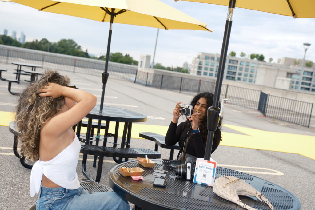 Influencers posing at FujiFilm rooftop roller skating media and influencer event planned and managed by Swerve Strategic Marketing