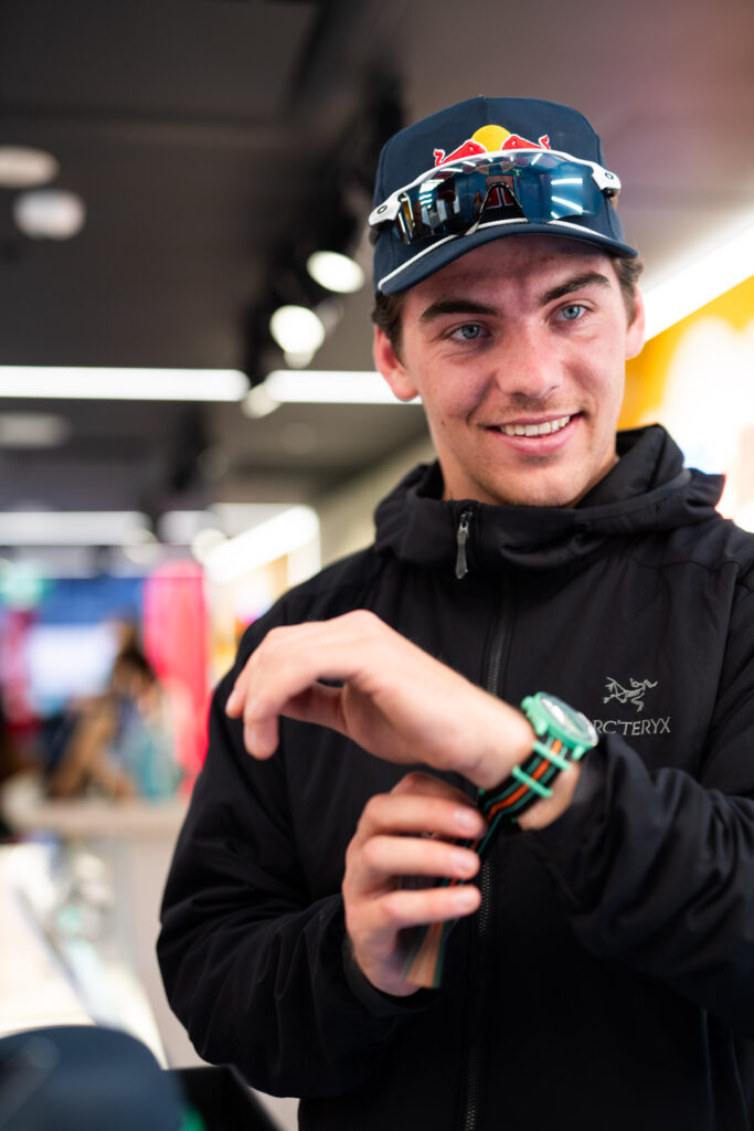 Influencer attending Swatch's flagship Vancouver store trying on a watch at an event managed by Swerve Strategic Marketing.