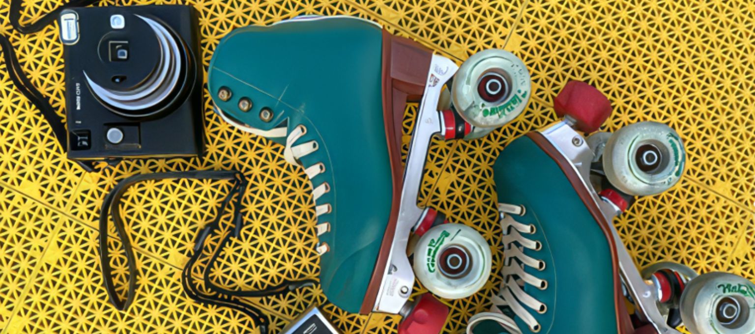 Roller skates + camera at FujiFilm rooftop roller skating media and influencer event planned and managed by Swerve Strategic Marketing