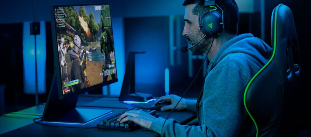 Razer gaming user gaming at desk