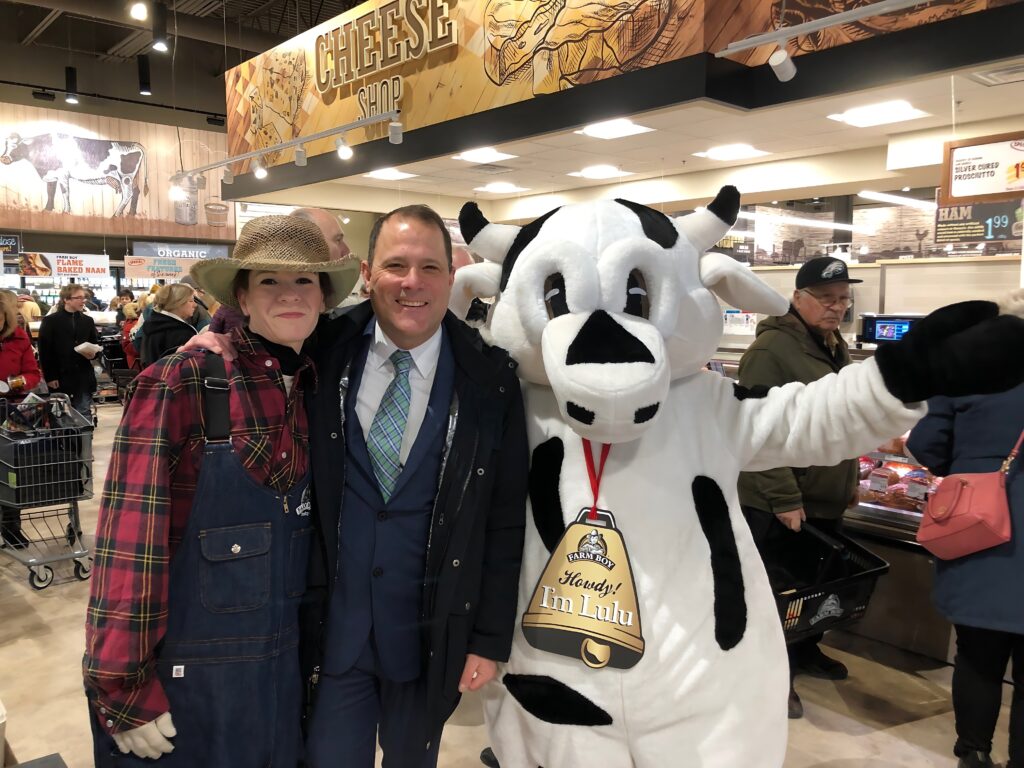 Store manager with Farm Boy mascots