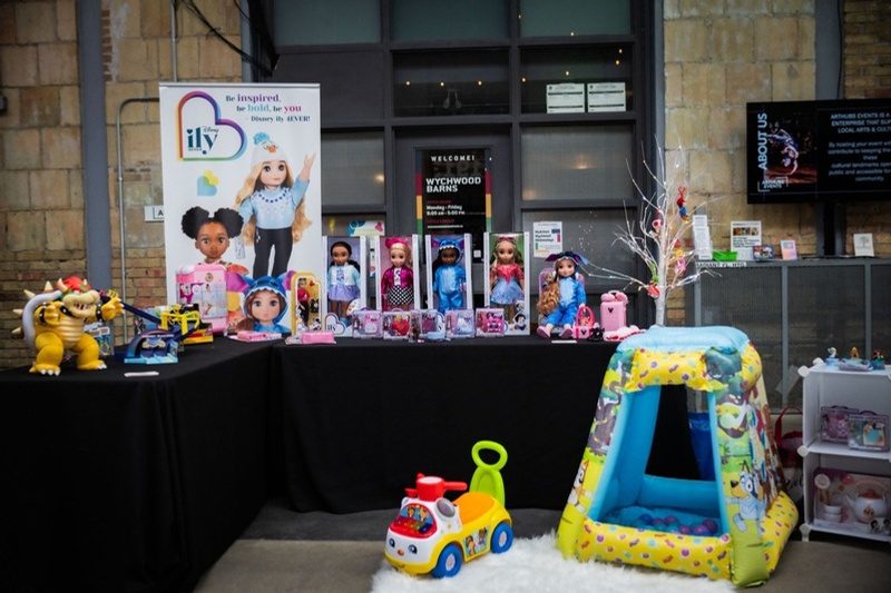 An exhibitor booth of holiday toys at Let's Play Holiday 2025