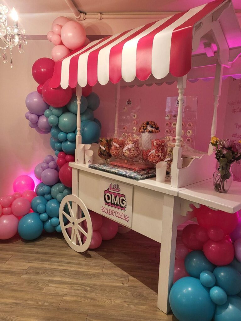 L.O.L. Surprise! O.M.G. Sweet Nails candy cart and balloon arch at the Swerve launch event