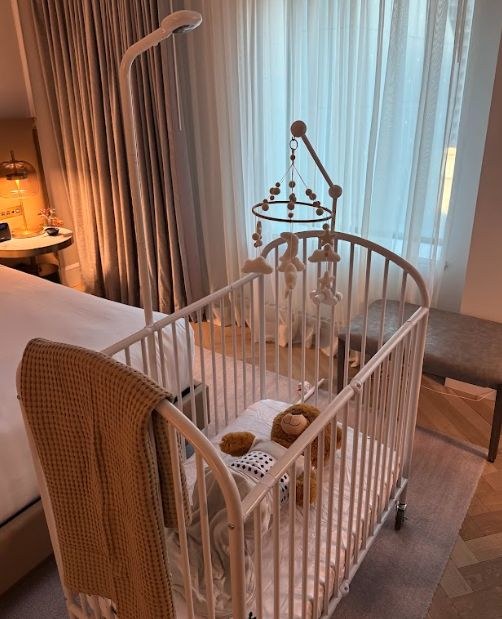 Crib and mobile set up in the Nanit media suite at the Vogue Hotel, Montréal